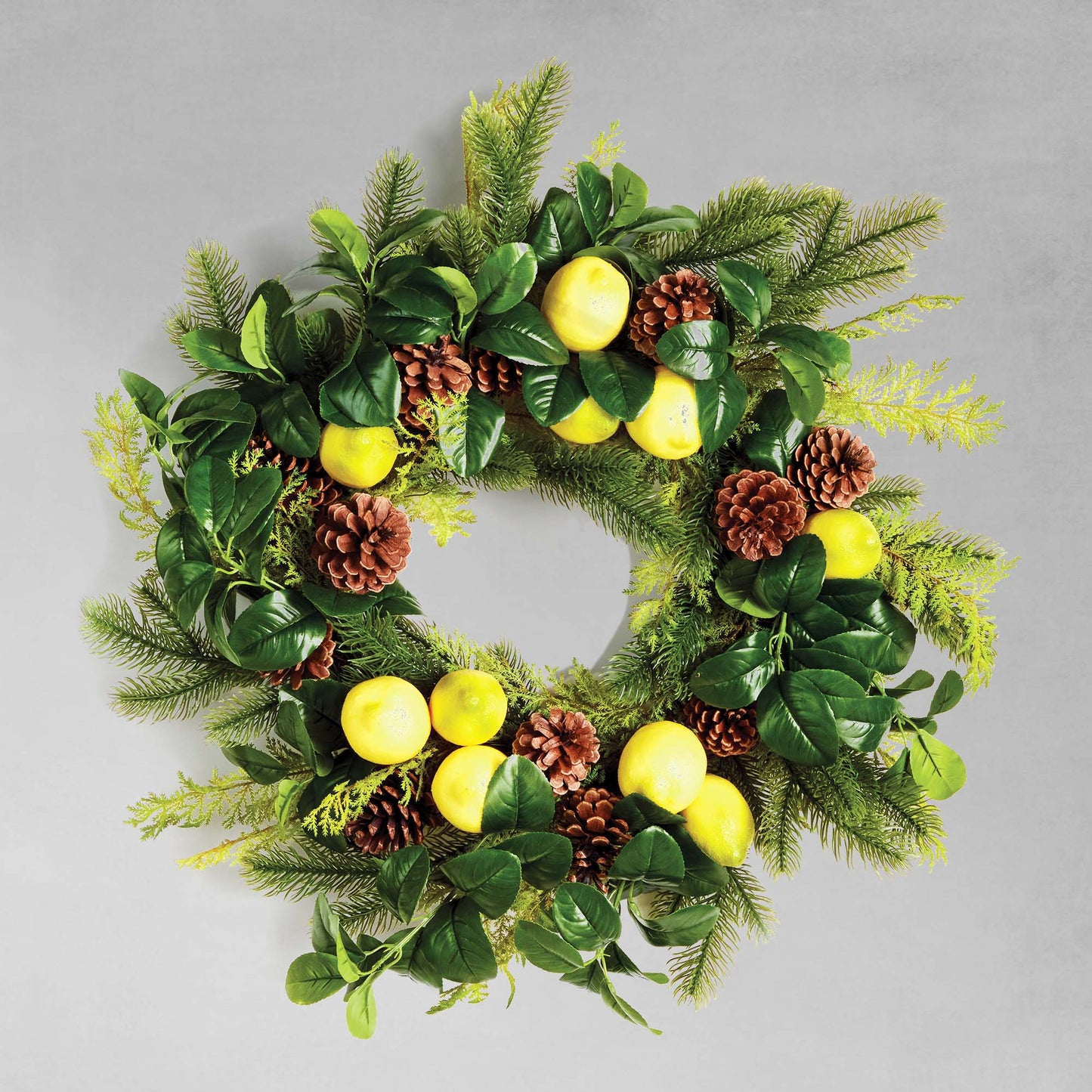 26" faux lemon and mixed botanicals wreath with gray background.