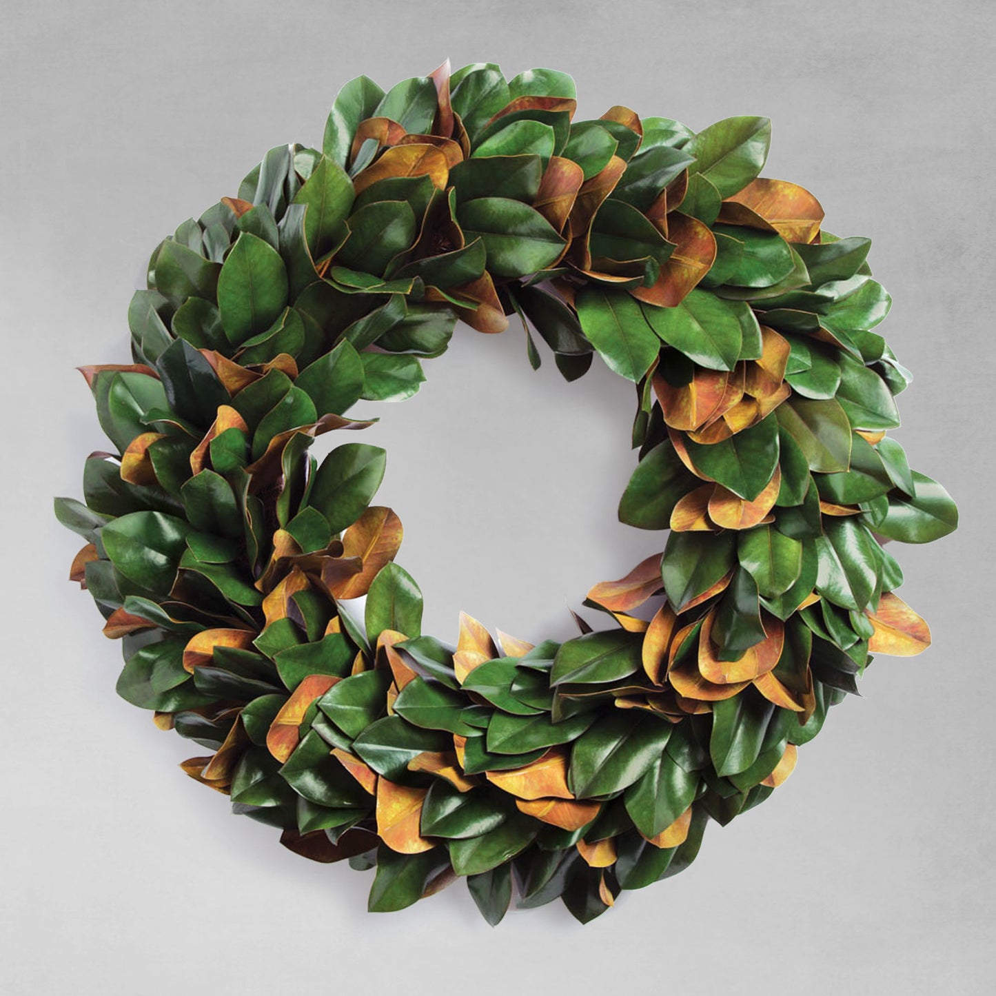 30" faux magnolia leaf wreath with gray background.