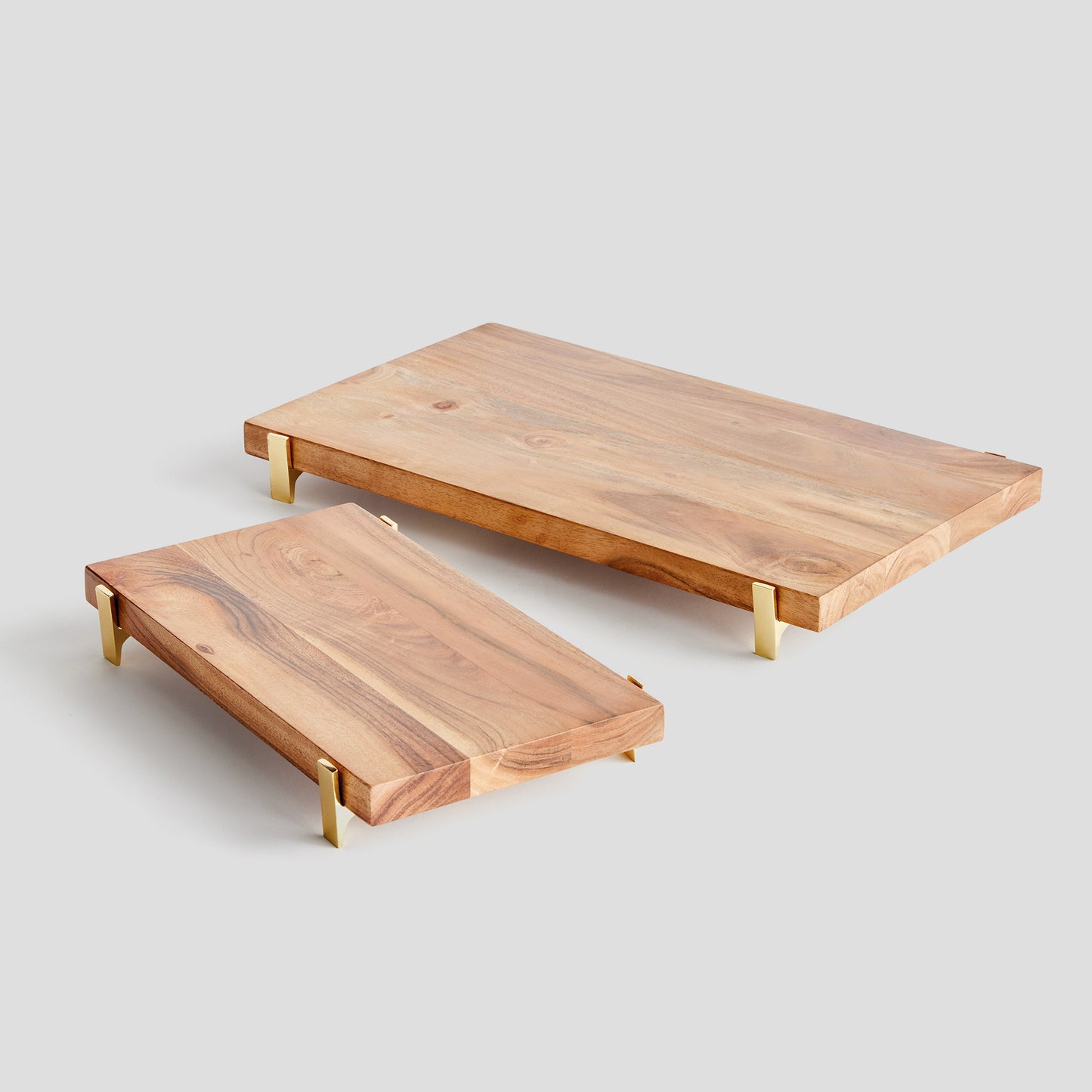 Acacia wood rectangular serving board, angled top view, with gray background.