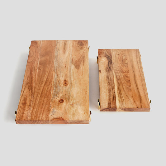 Acacia wood rectangular serving board, top view, with gray background.