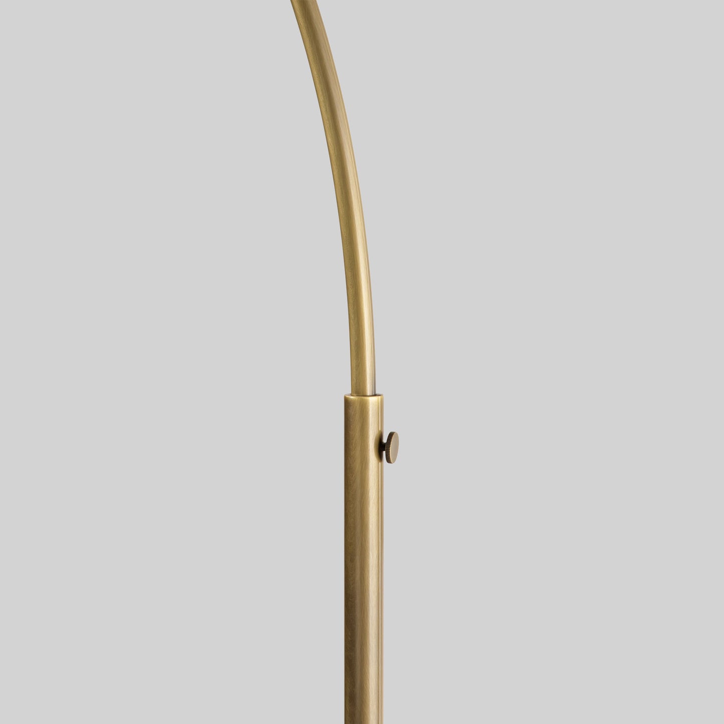 Floor lamp with a curved arm and wooden base on a light gray background.