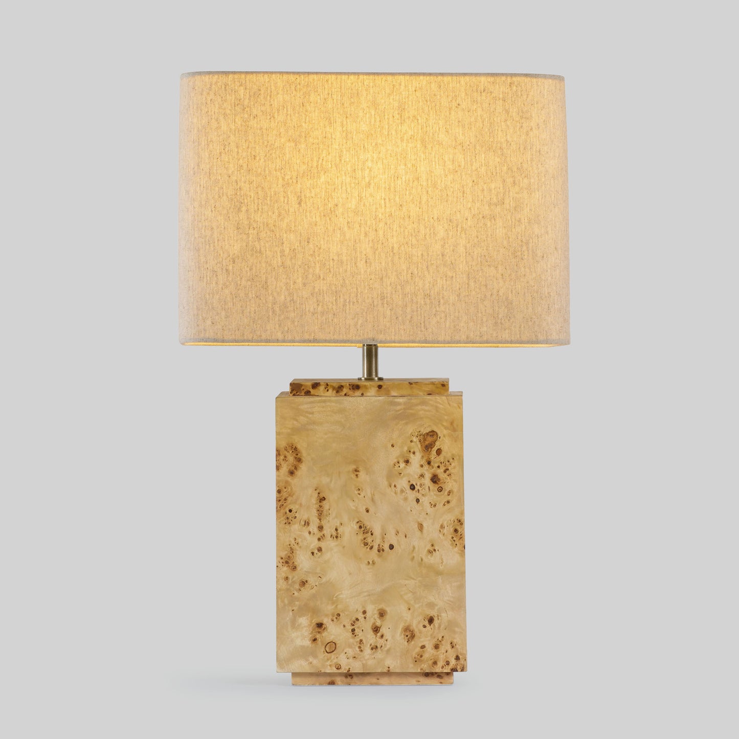 Burl wood table lamp on a light gray background.