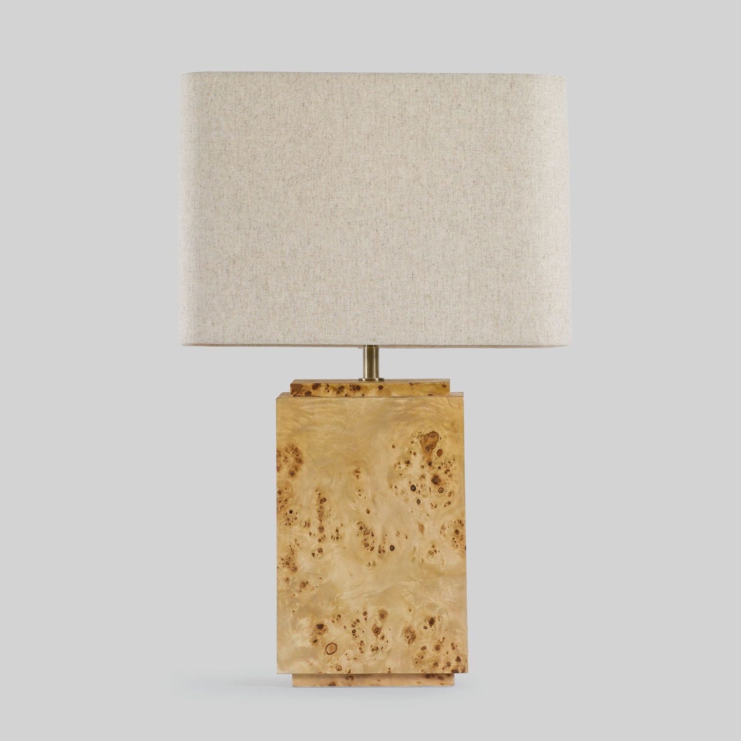Burl wood table lamp on a light gray background.