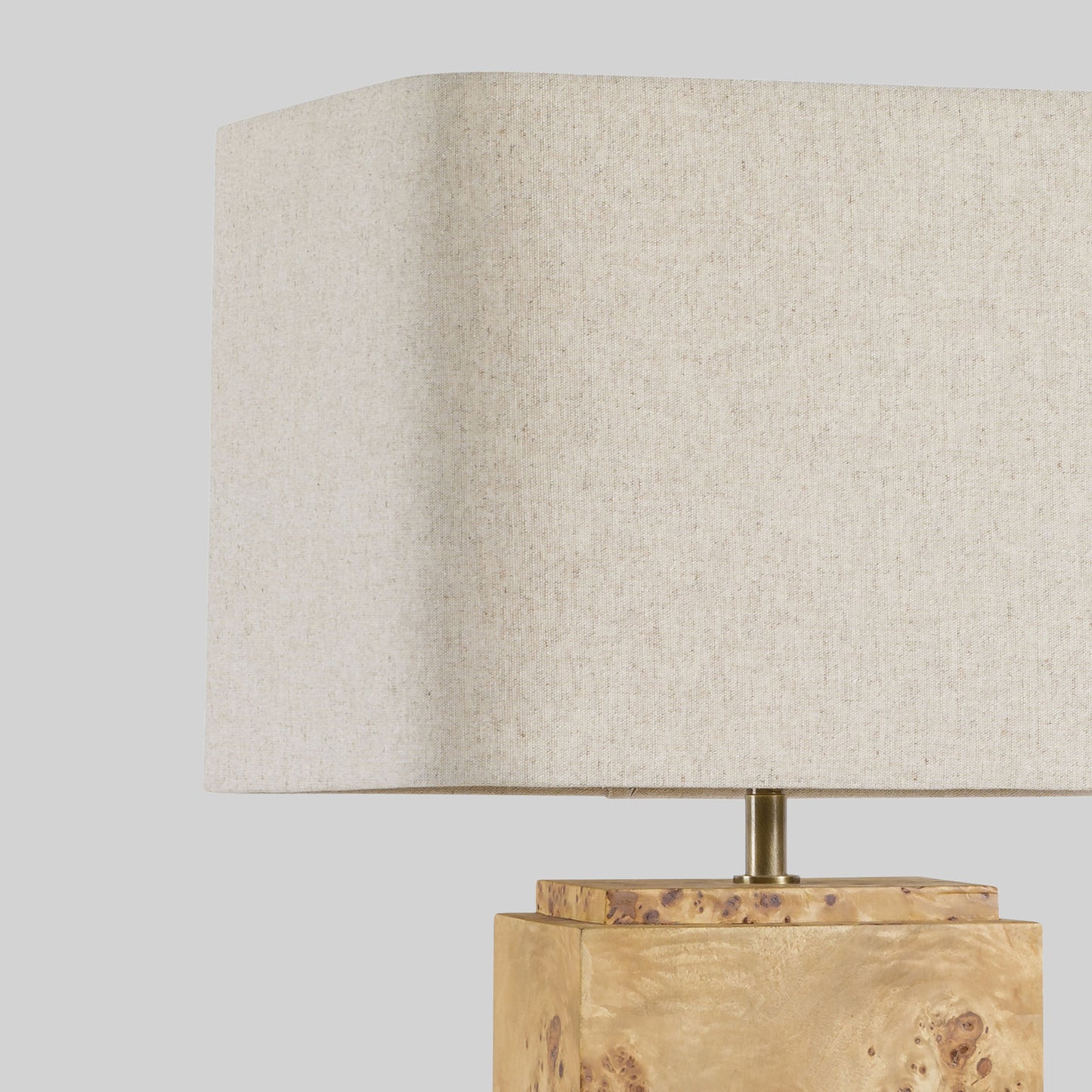 Burl wood table lamp on a light gray background.