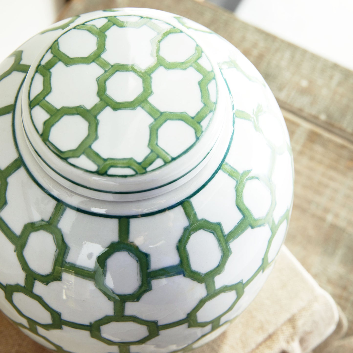 Chinoiserie green and white porcelain decorative jar, closeup view of top of jar.