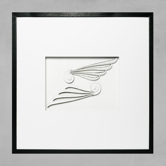 Contemporary framed Greek scroll wings artwork with white mat and black wooden frame on gray background.