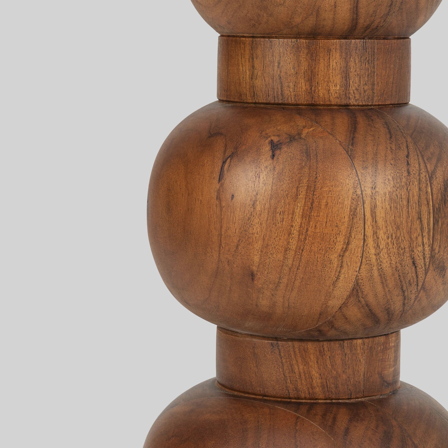 Wooden side table with a white marble top on a gray background.