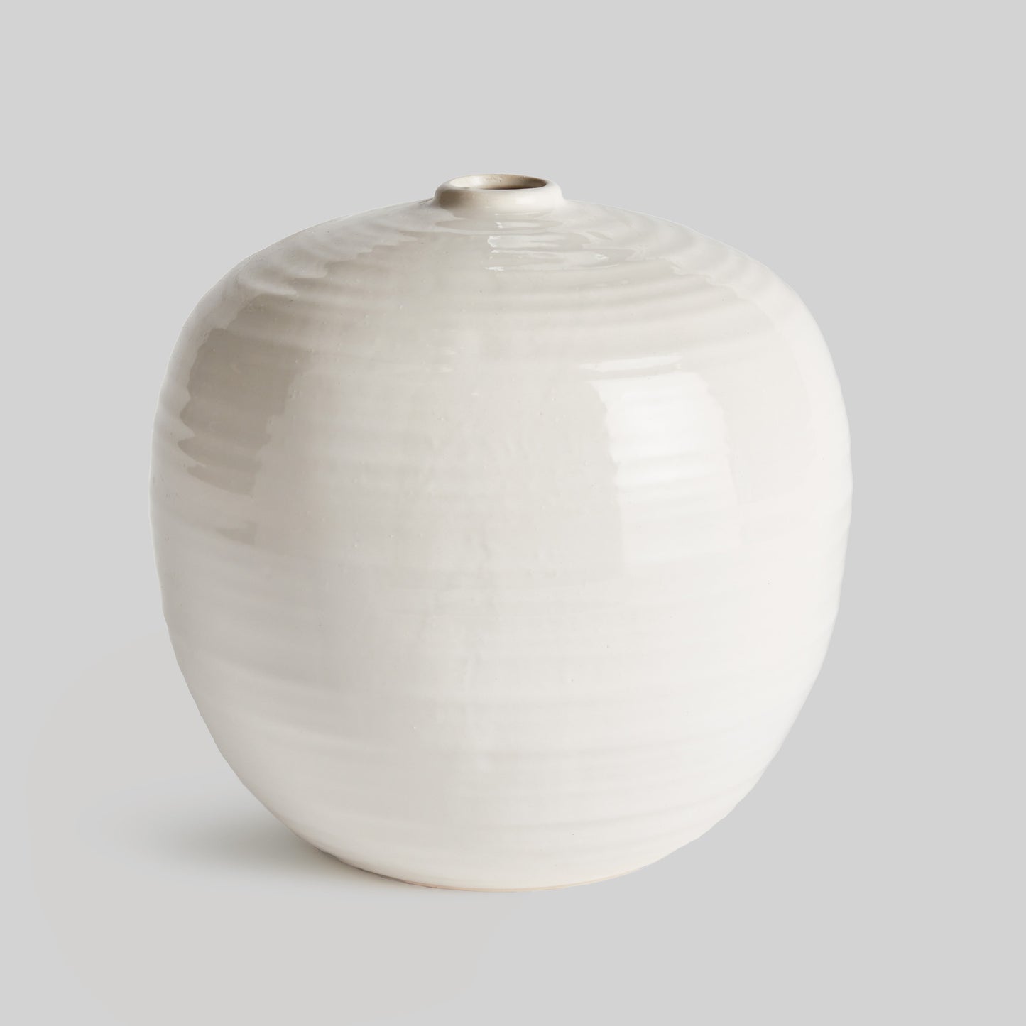 Contemporary white stoneware bulbous small vase - stylish home accent (Image1).