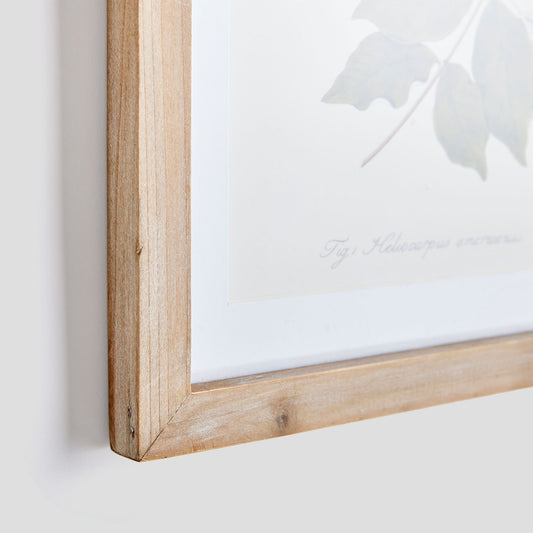 Gallery wall art set of green botanicals closeup view of wood frame.