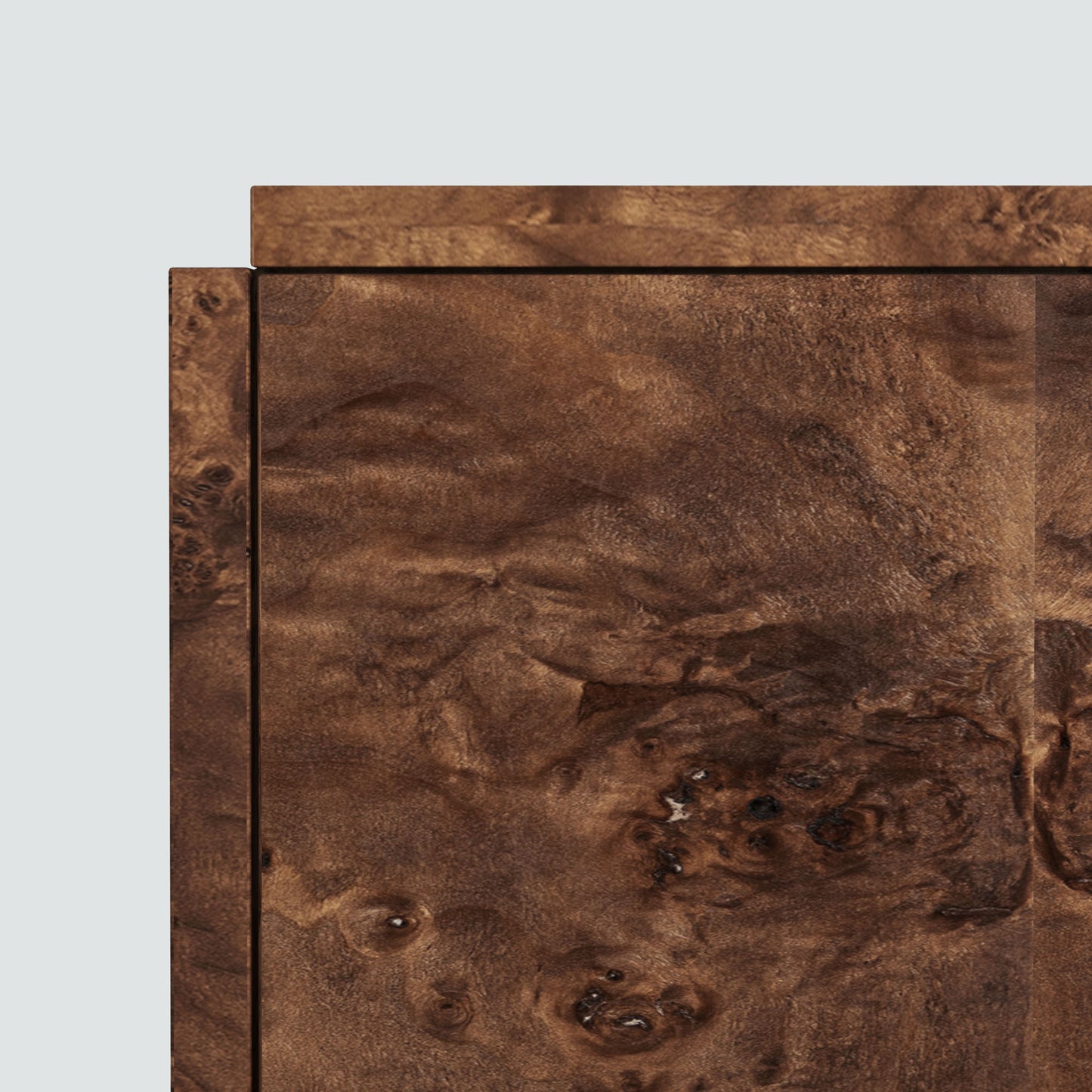 Dark burl wood sideboard on gray background.