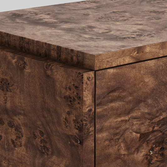 Dark burl wood sideboard on gray background.