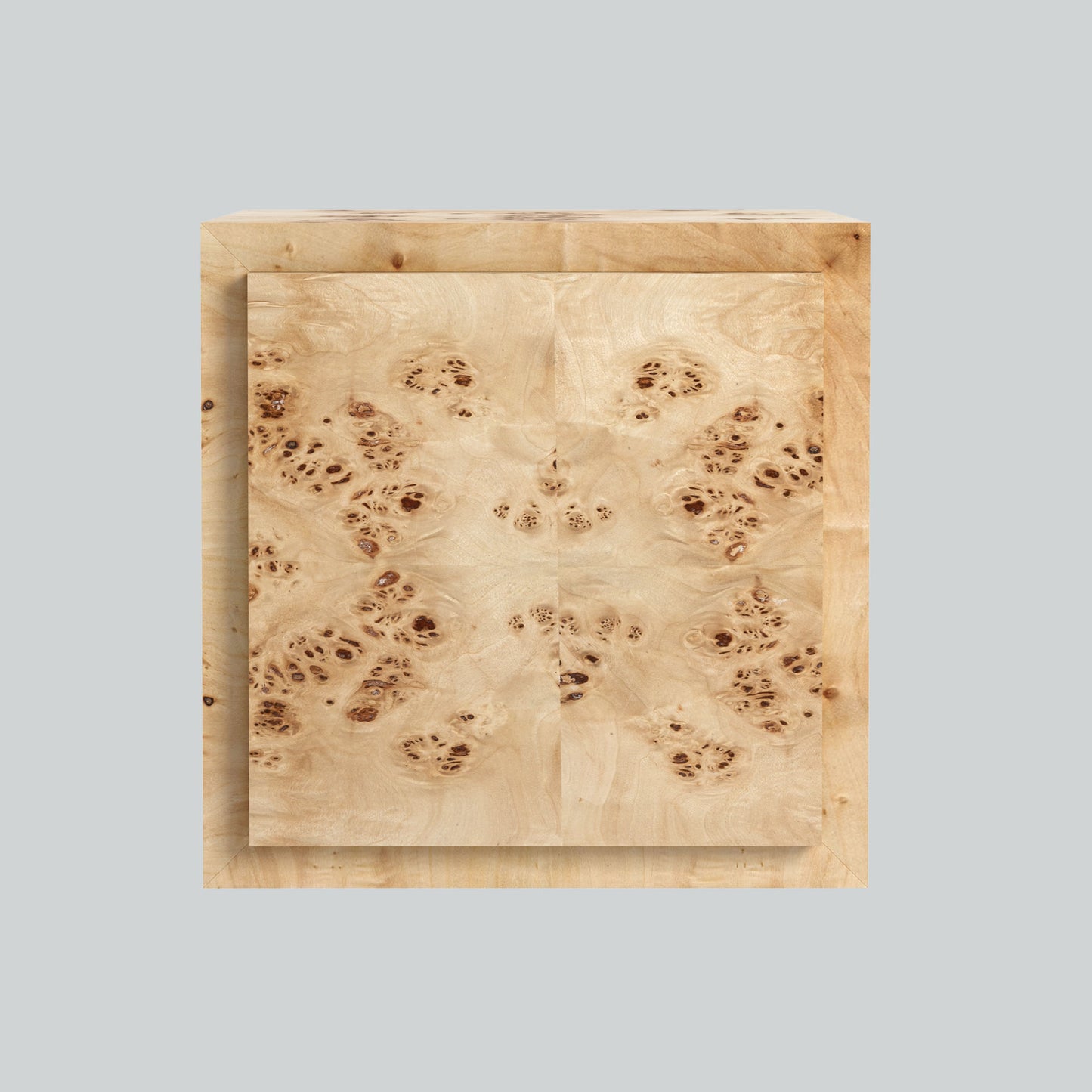 Light burl wood plinth side table on gray background.