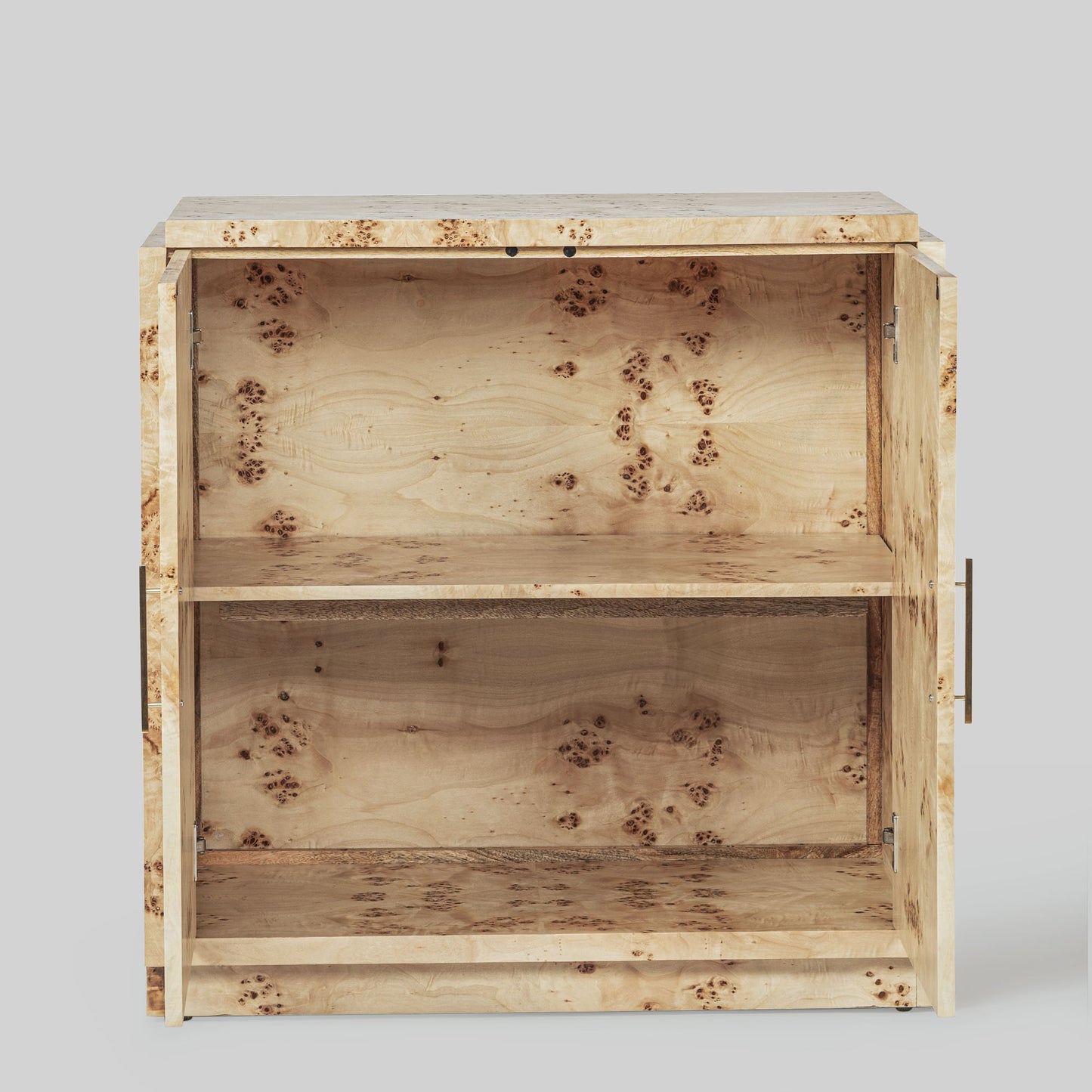Light burl wood sideboard table on gray background.
