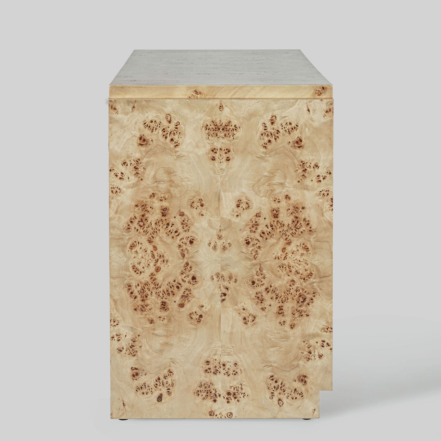 Light burl wood sideboard on gray background.