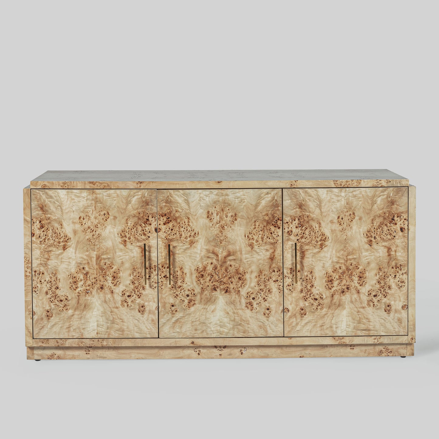 Light burl wood sideboard on gray background.