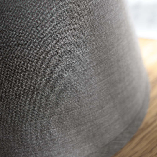 Closeup of gray concrete mini lamp lampshade.