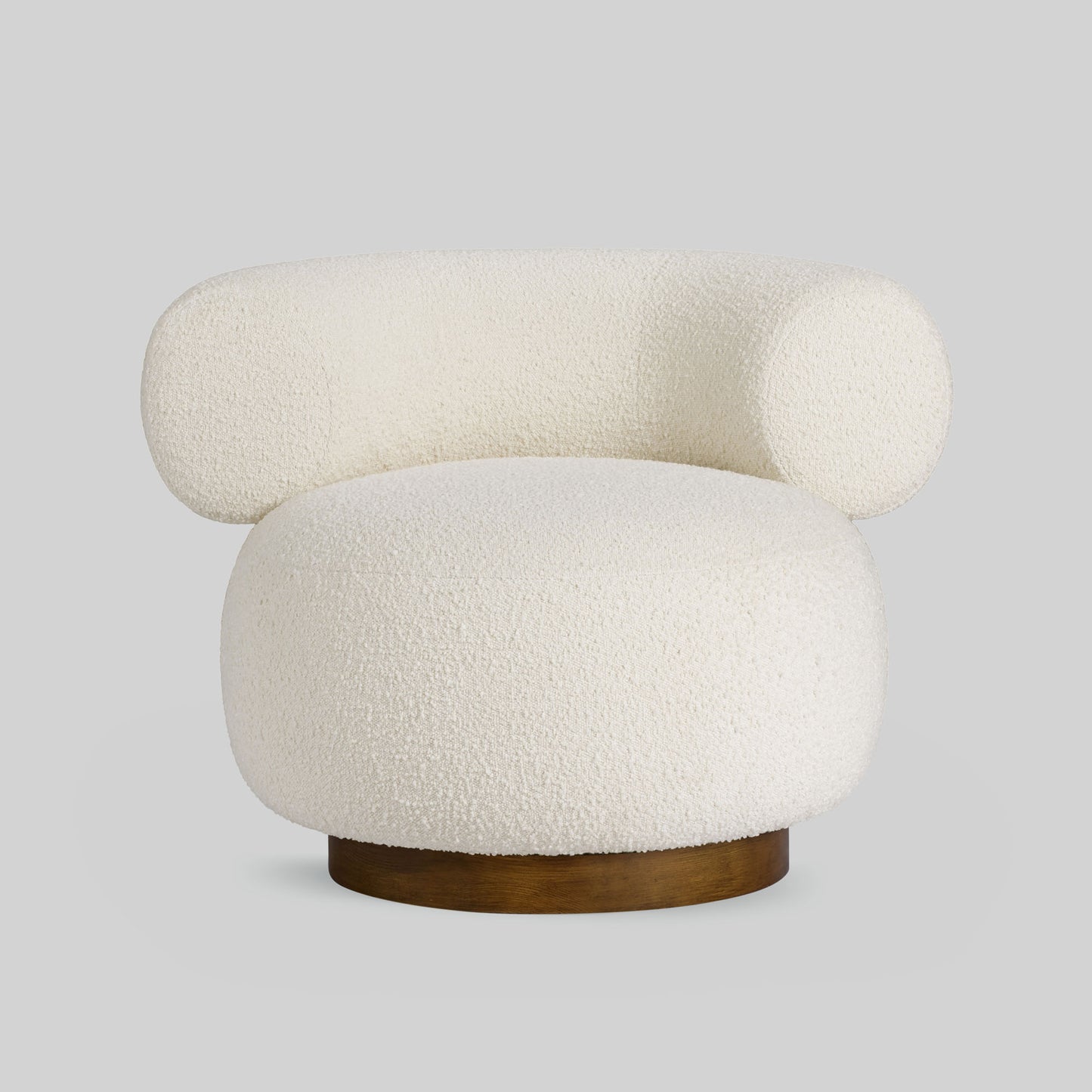 Light colored boucle fabric swivel chair on gray background.