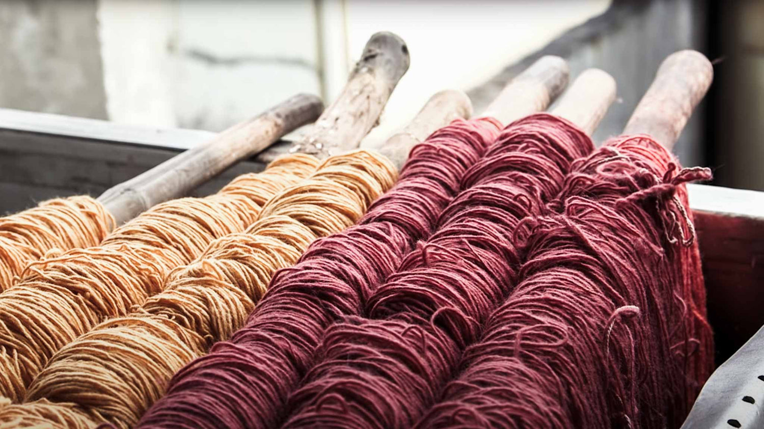 Red and yellow yarns in Indian textile factory.