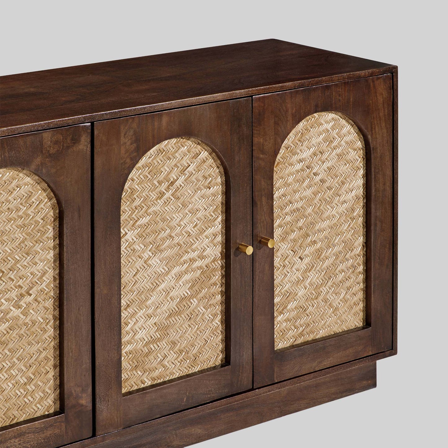 Wooden sideboard with four arched doors featuring a textured rattan design on a gray background.