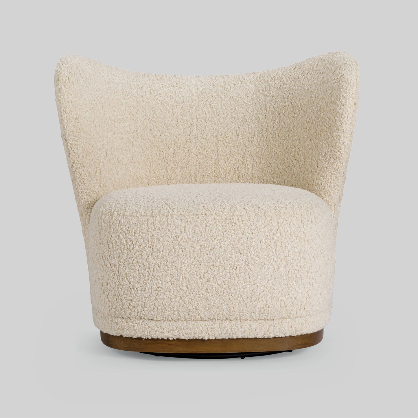 Cream toned sherpa fabric textured lounge chair on gray background.