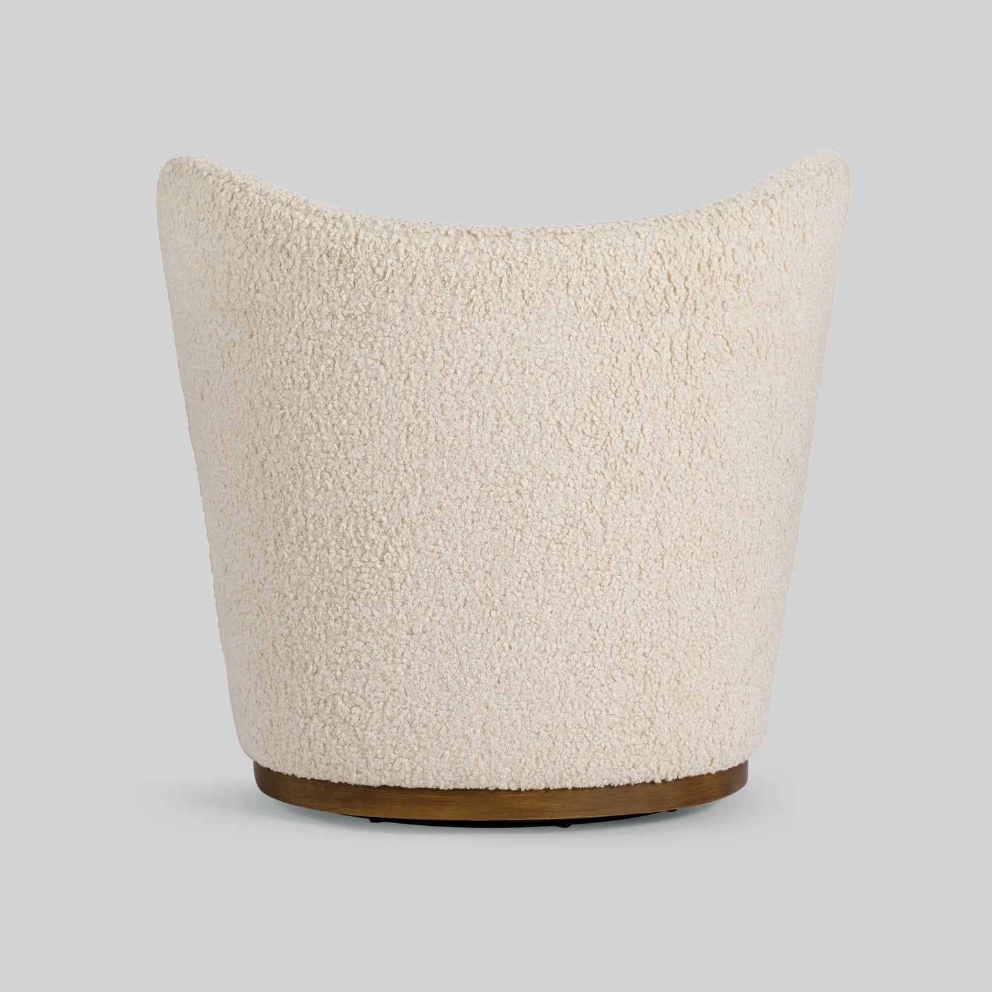 Cream toned sherpa fabric textured lounge chair on gray background.