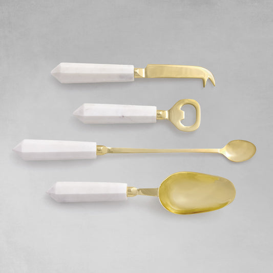Marble and gold stainless steel barware tools set with gray background.