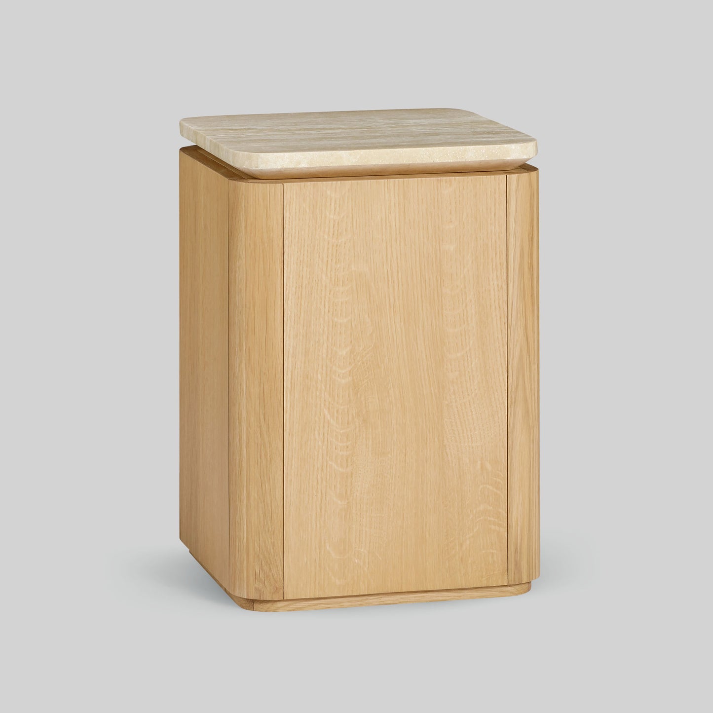 Wooden side table with a light oak finish and travertine top on a gray background.