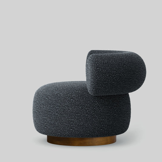 Gray textured fabric armchair on a light gray background.