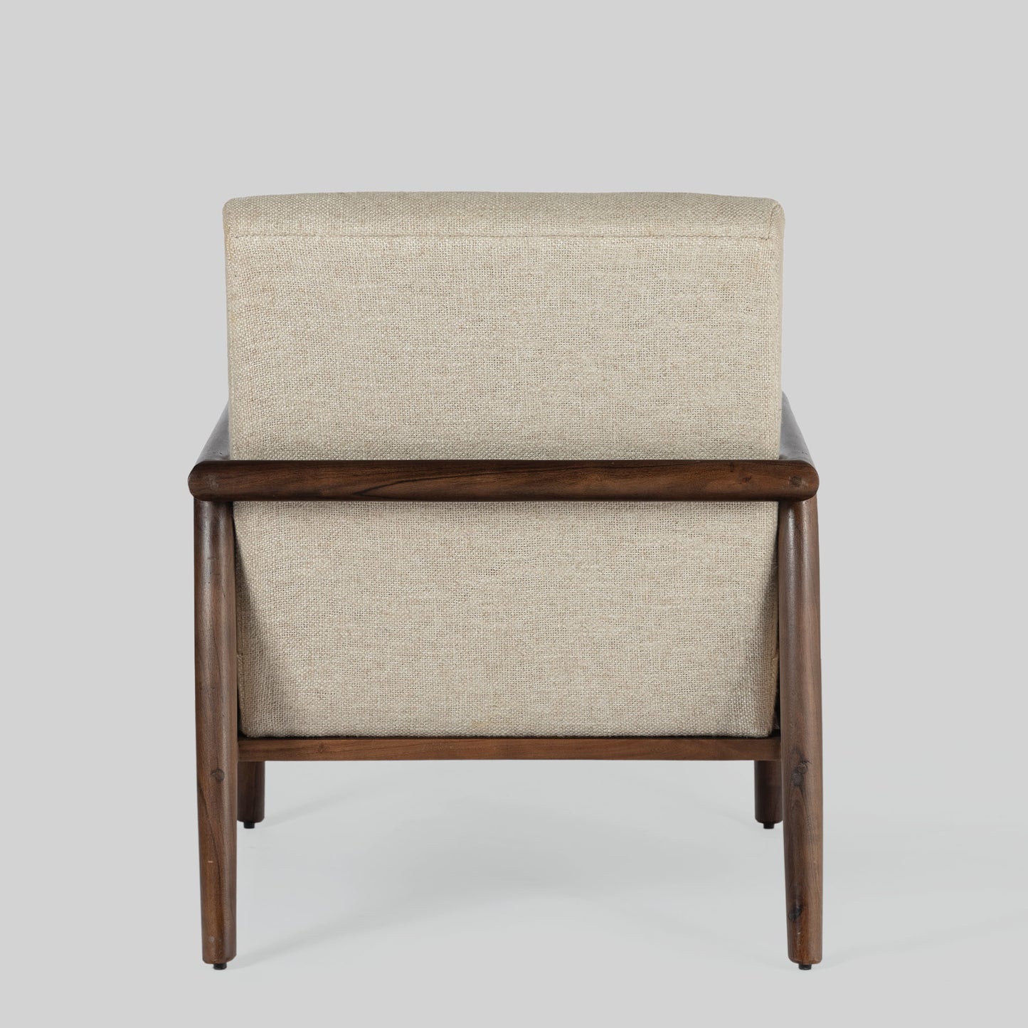 Beige armchair with cane arms and wooden frame on a light gray background.