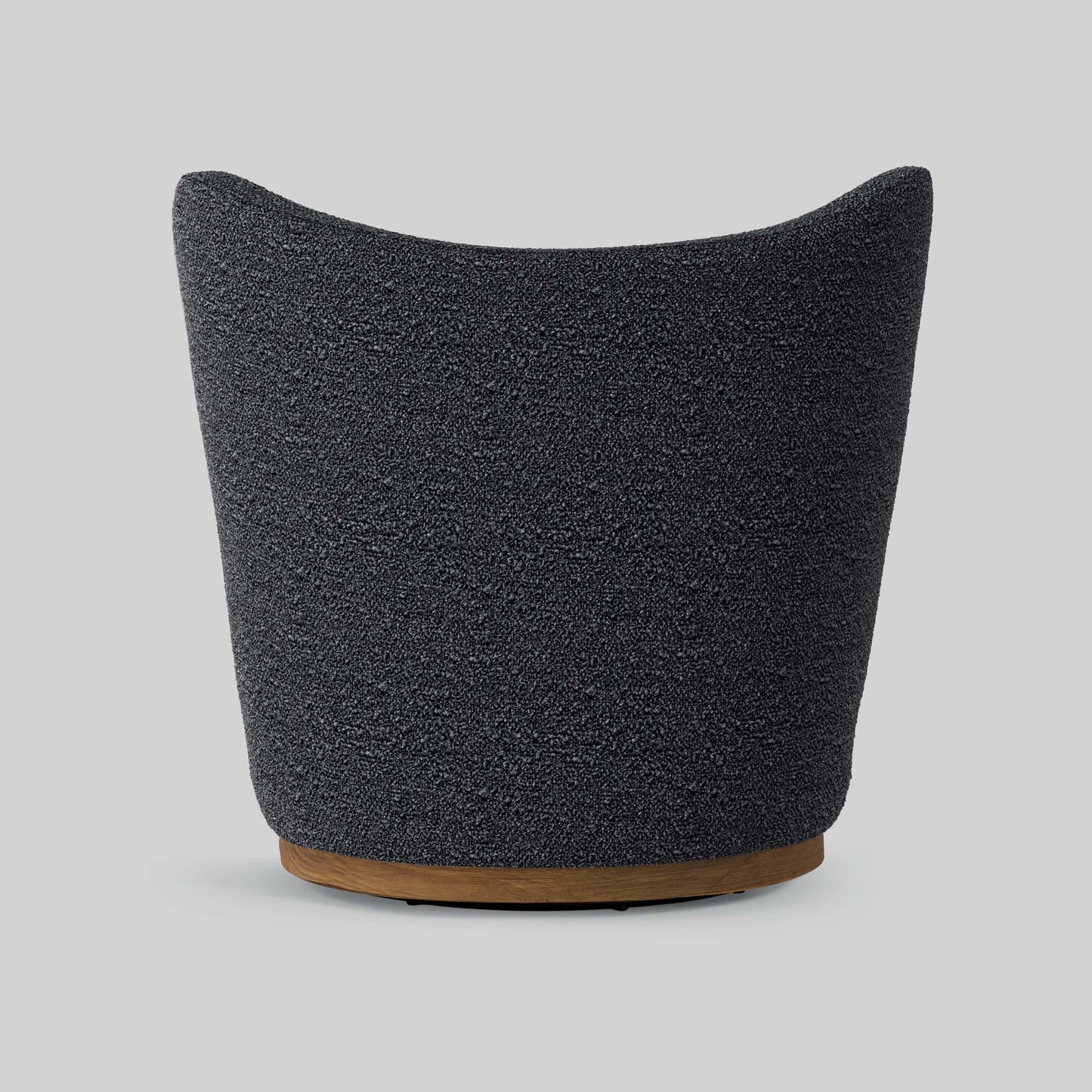 Dark gray boucle fabric lounge chair on gray background.