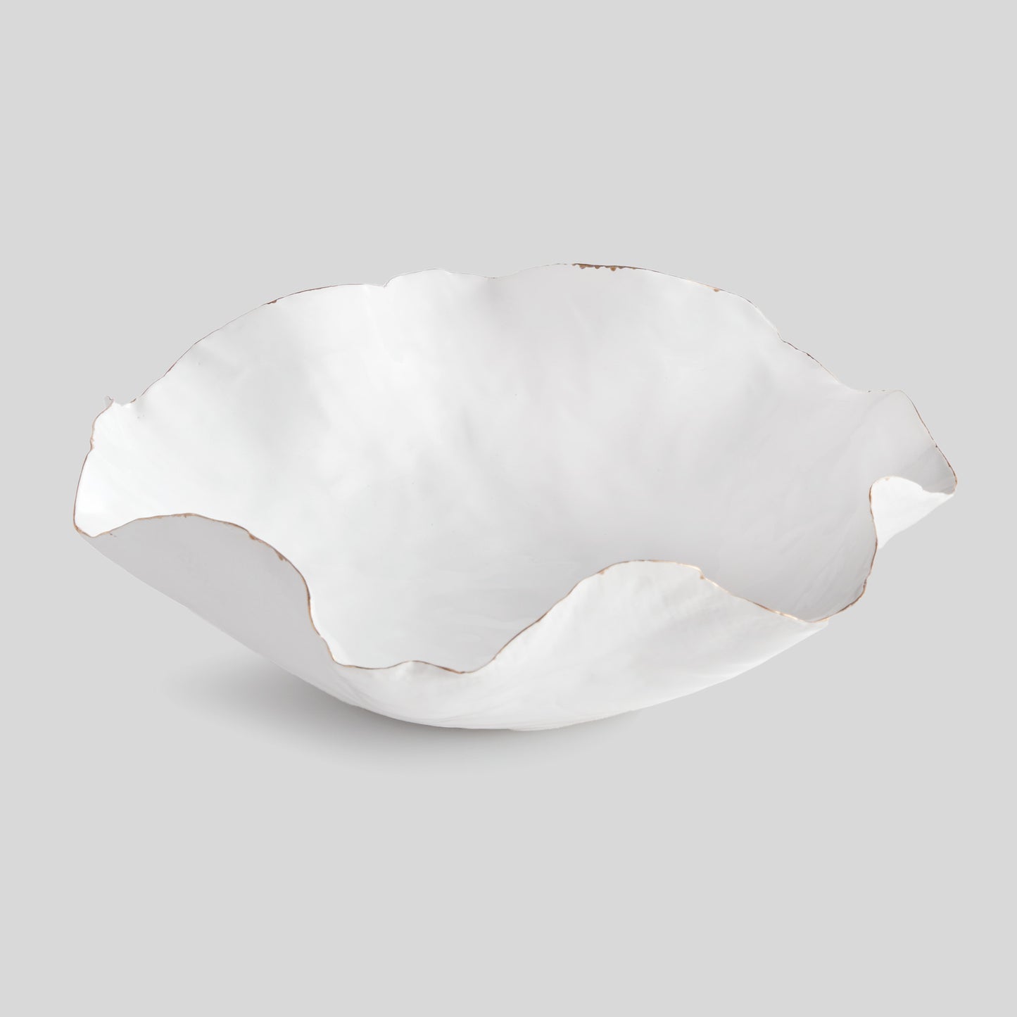 Organic decorative ceramic large bowl with gray background.