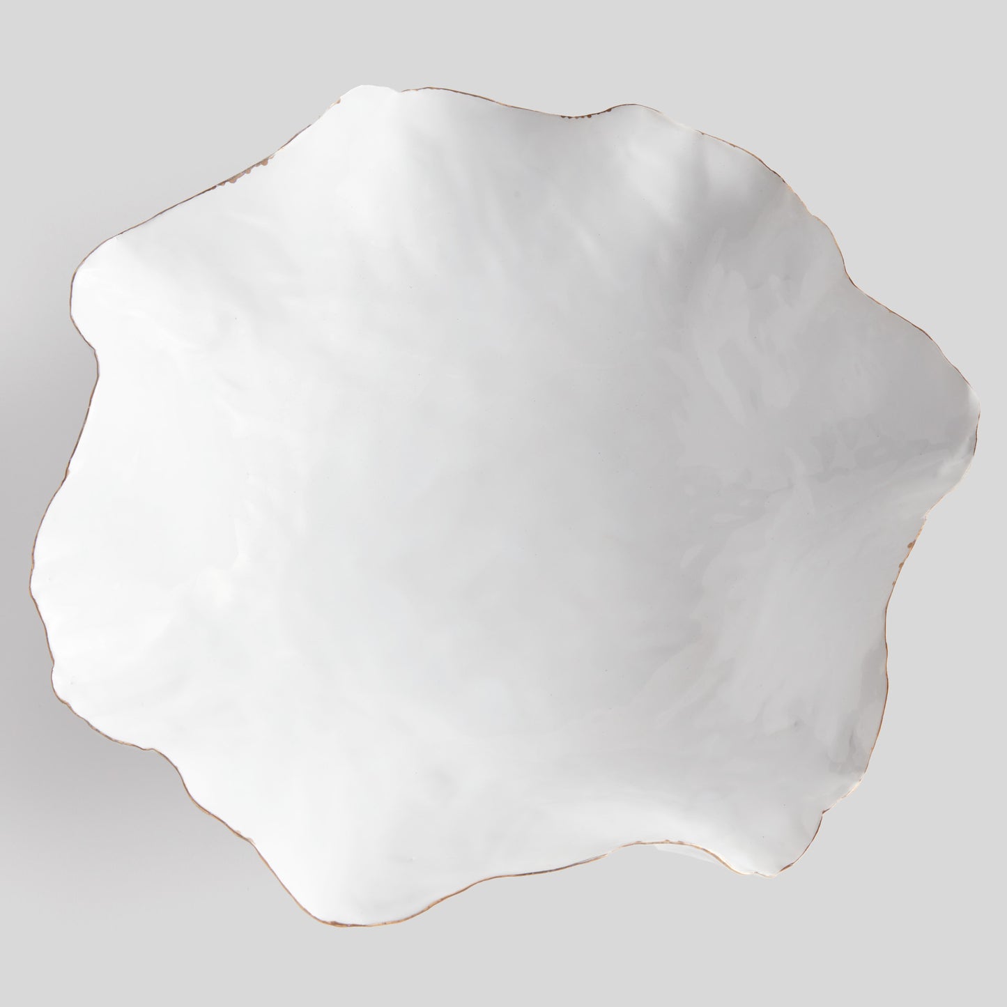 Organic decorative ceramic large bowl, top view, with gray background.