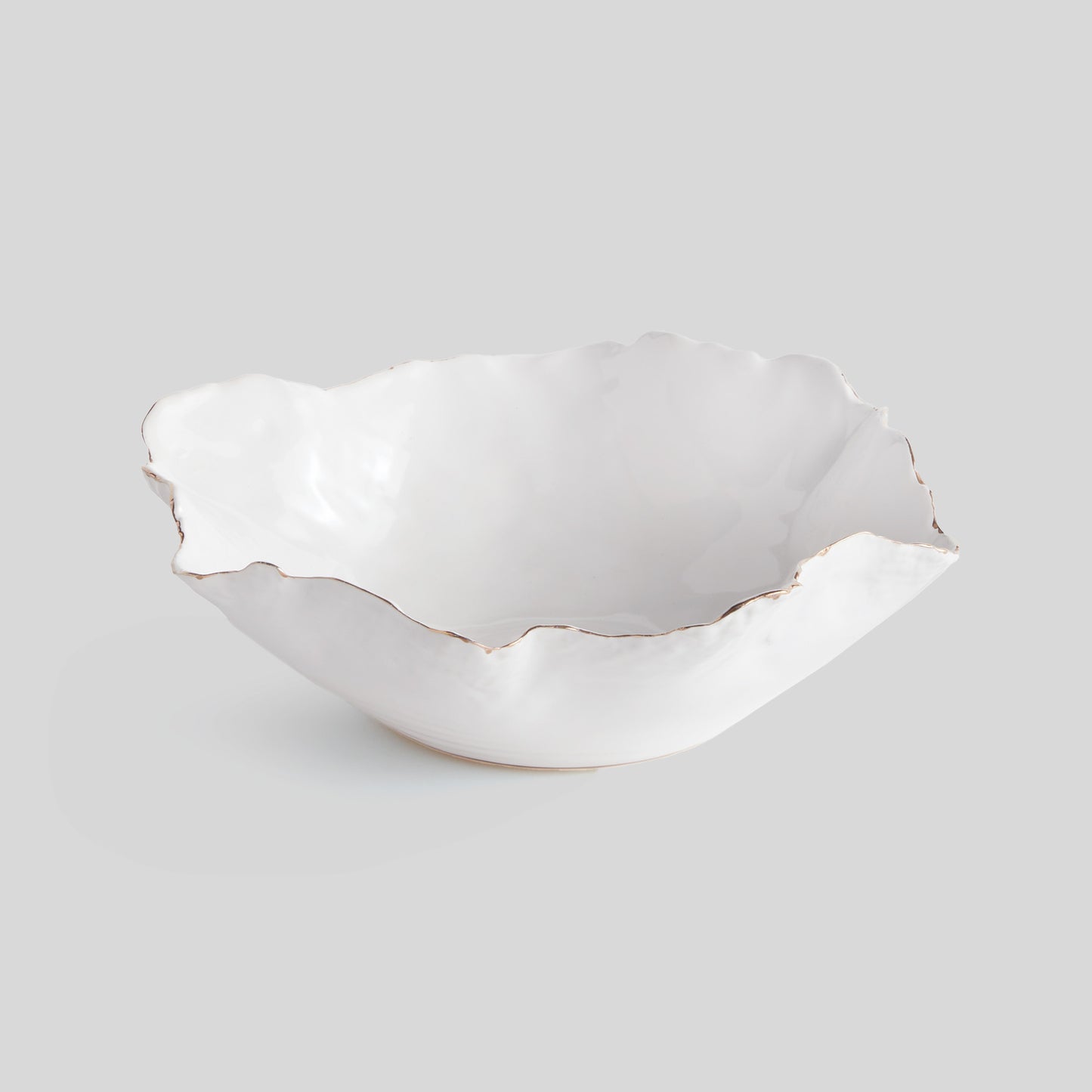 Organic decorative ceramic small bowl with gray background.