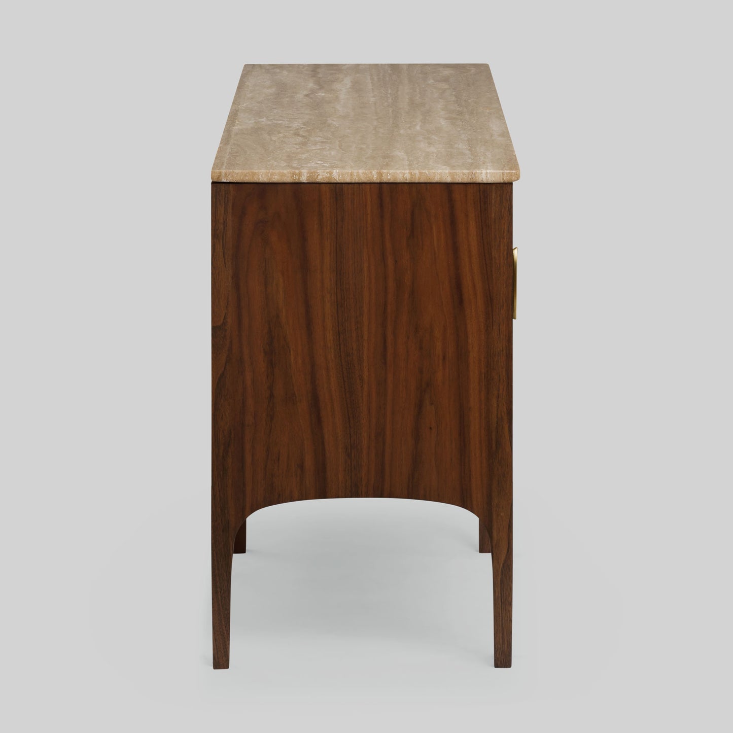 Wood sideboard with travertine stone top on light gray background.