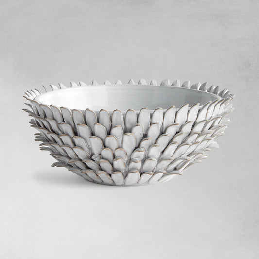 Petal decorative terracotta bowl with gray background.