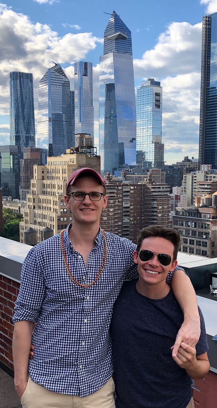 Jeffrey and Adam in New York City with skyline view in the background.