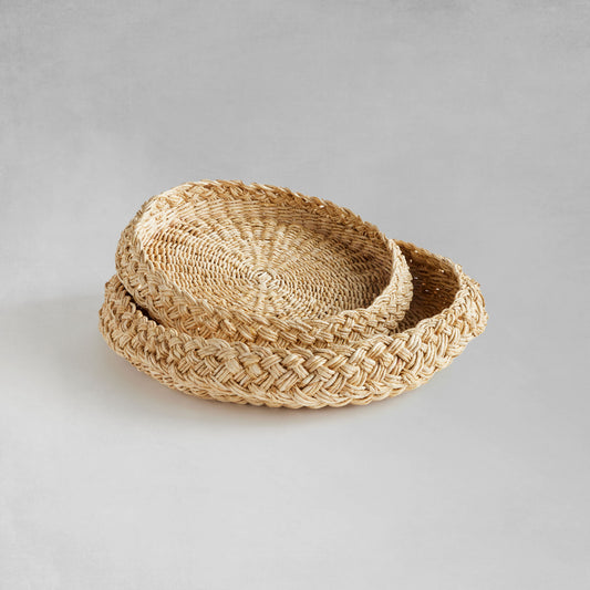 Round braided trays nested with gray background.
