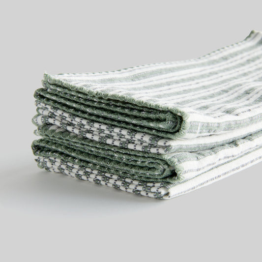 Sage green striped square cotton dinner napkins set of 4, closeup view of edge detailing.