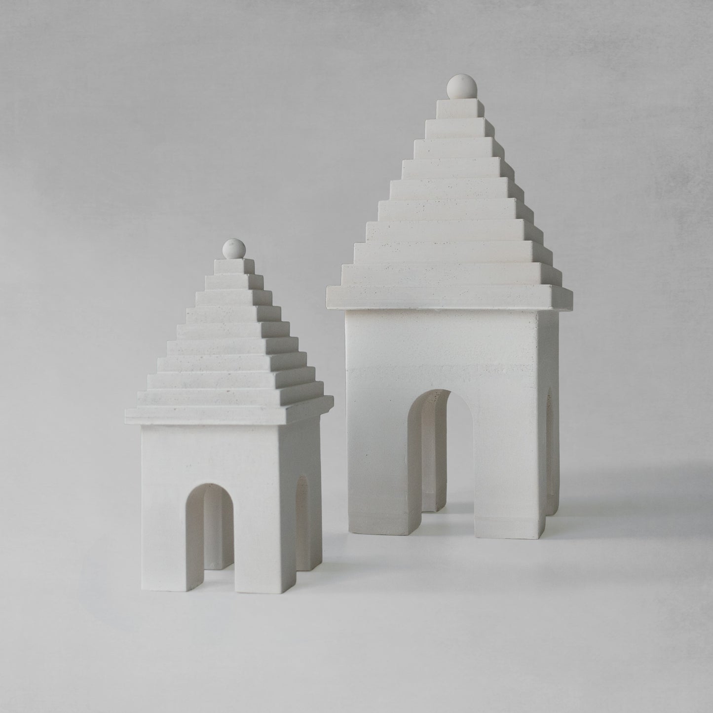 Weathered Bermudian buttery decorative objects with gray background.