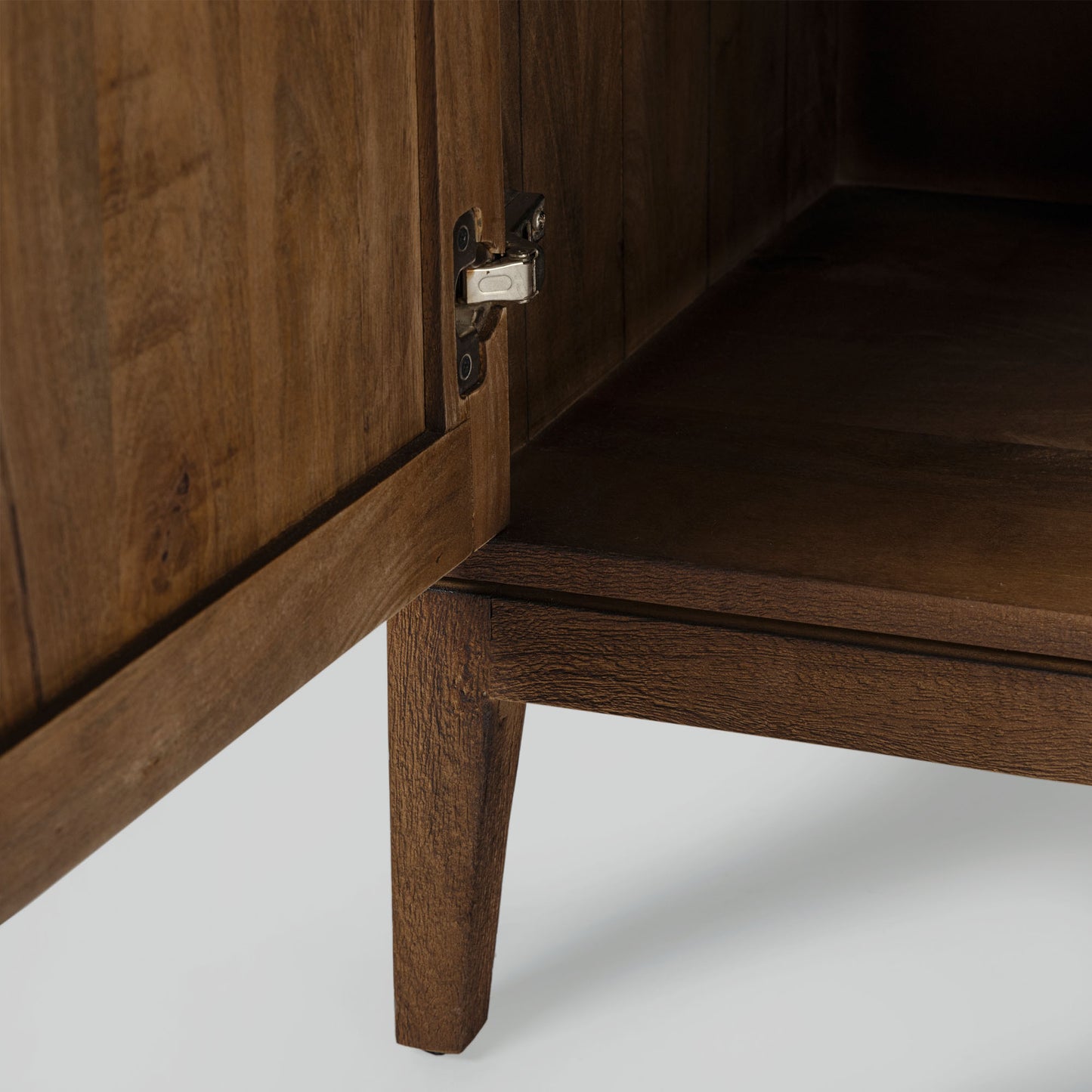 Wood sideboard with geometric pattern on a gray background.