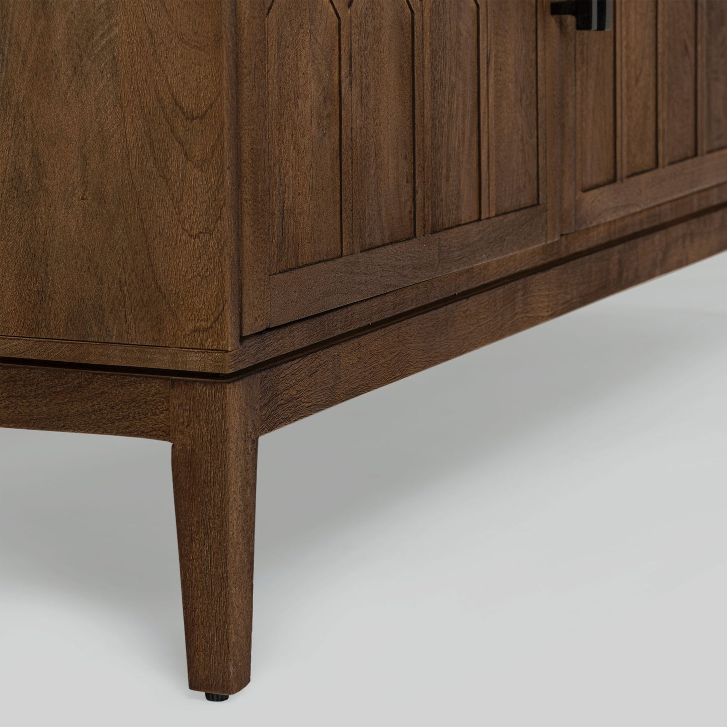 Wood sideboard with geometric pattern on a gray background.