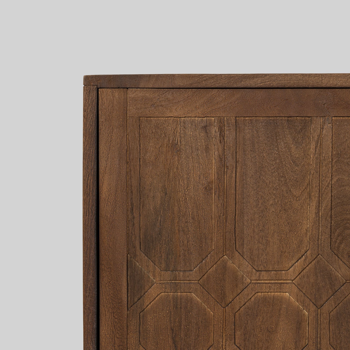 Wood sideboard with geometric pattern on a gray background.