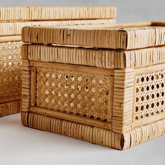 Woven rattan boxes, set of 2, closeup view of box side, with gray background.