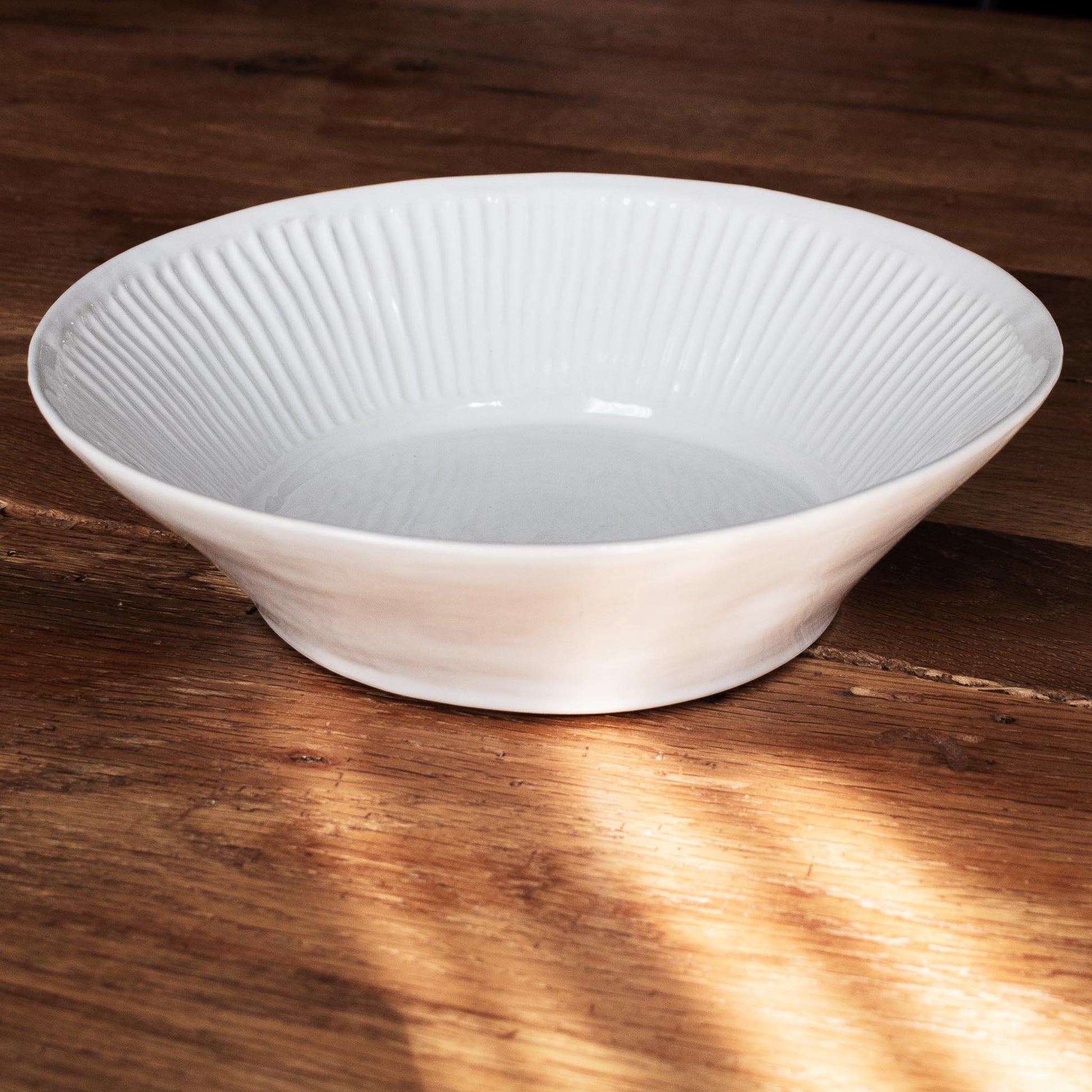 Artesa ceramic bowl/vessel on reclaimed wood table.