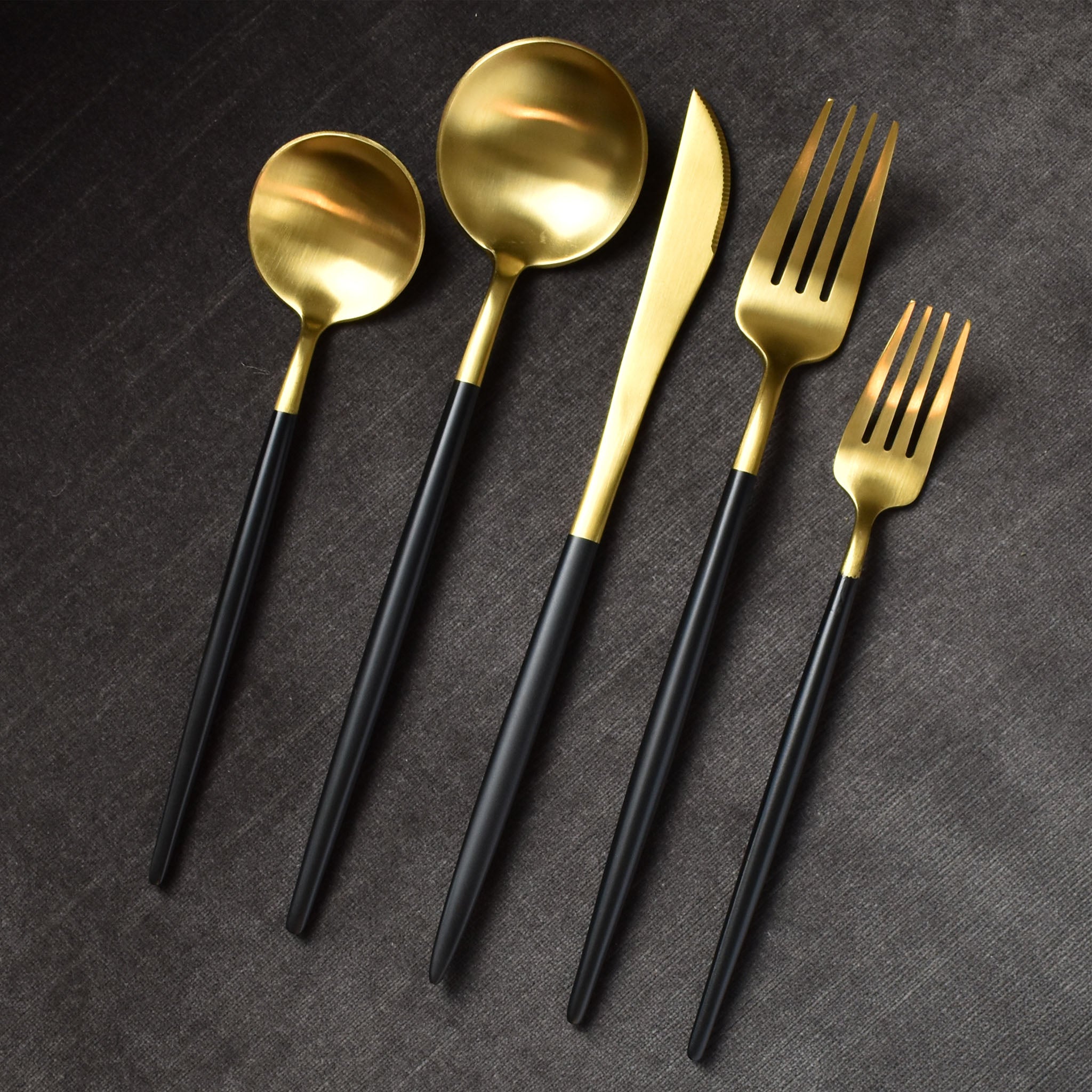 http://parkergibbs.com/cdn/shop/products/blackshear-matte-brushed-gold-black-long-handle-contemporary-flatware-cutlery-set.jpg?v=1599000096