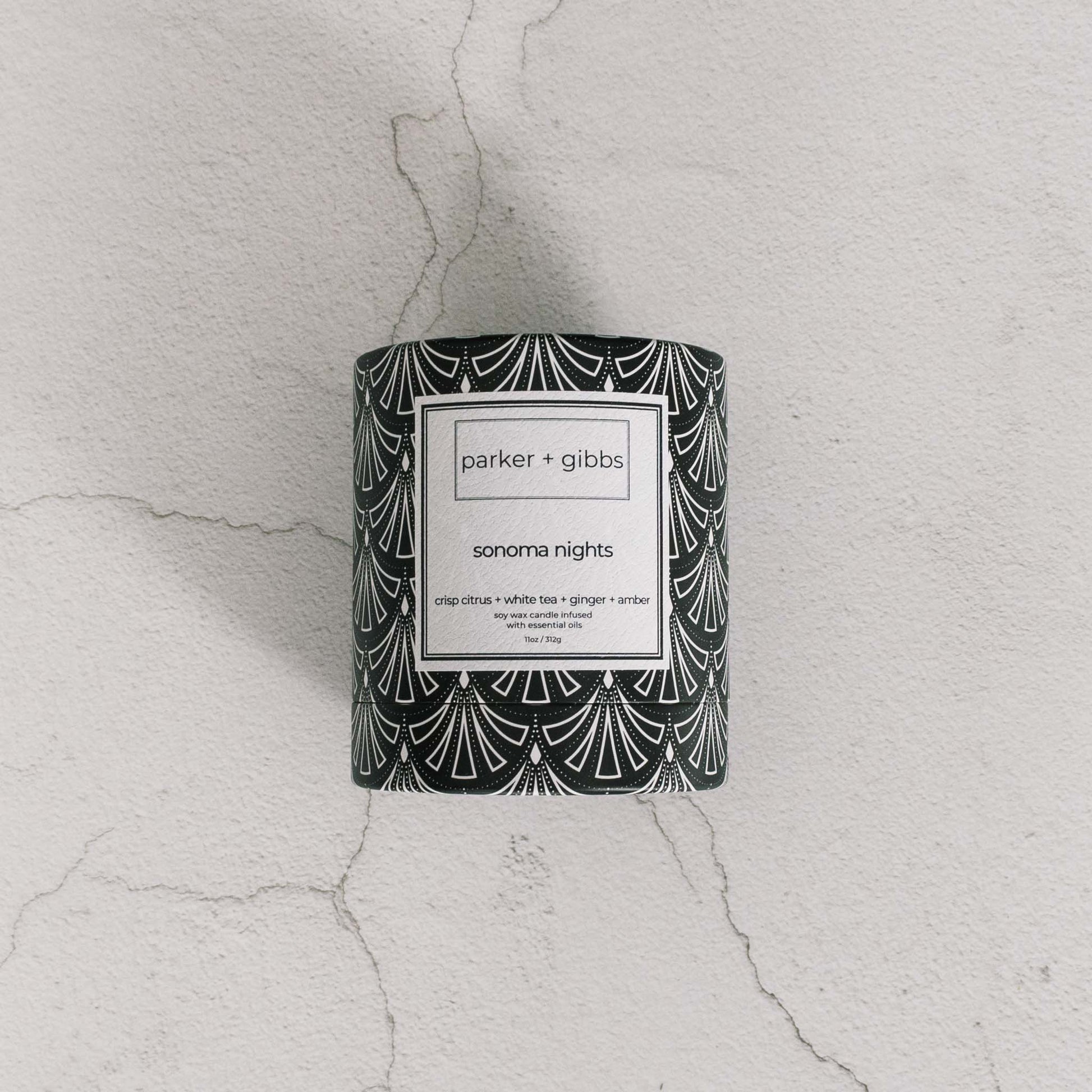 Sonoma Nights luxury soy wax blend candle box on limestone table.