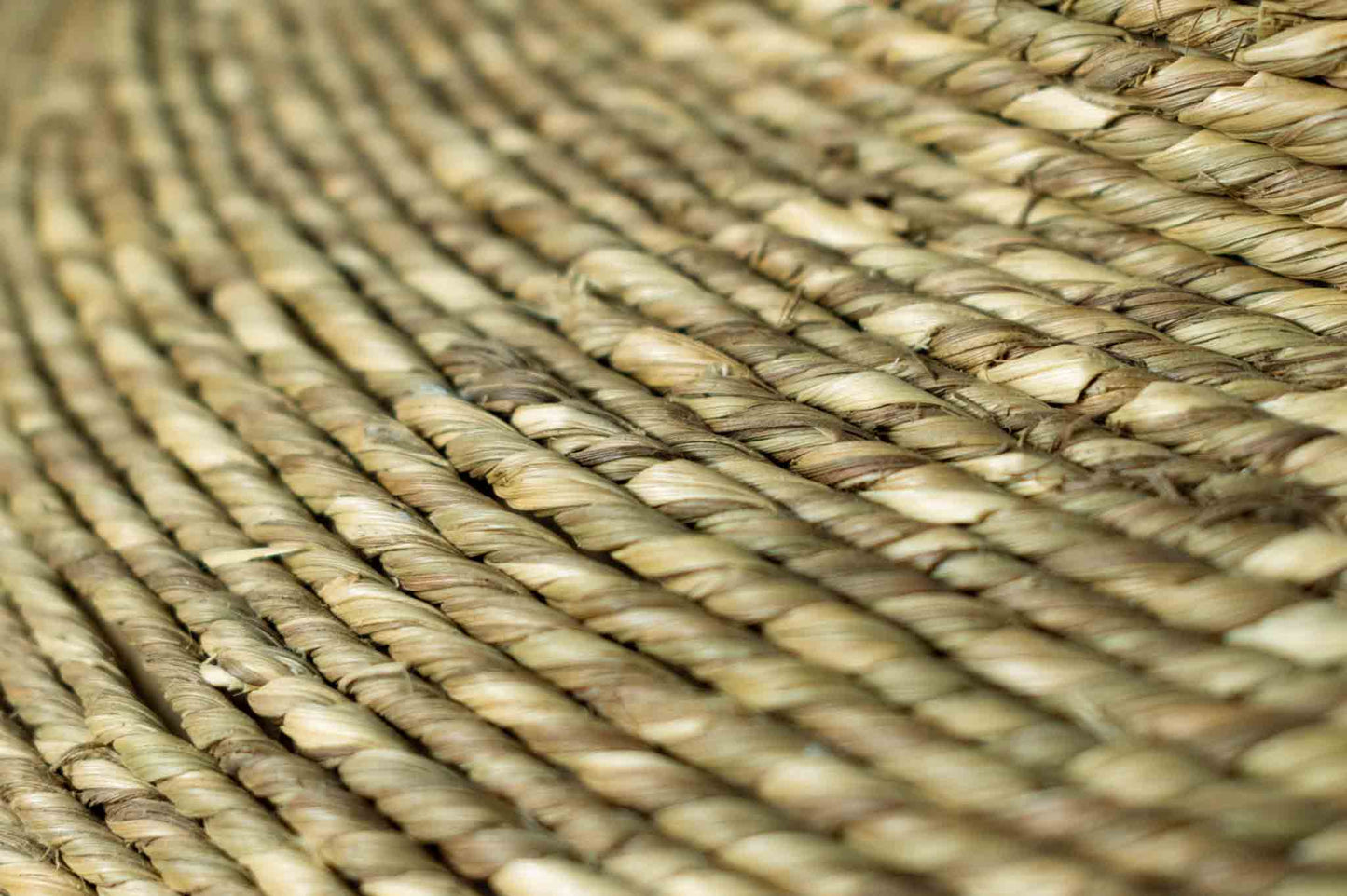 Handmade natural seagrass rope vessel up-close view of material.