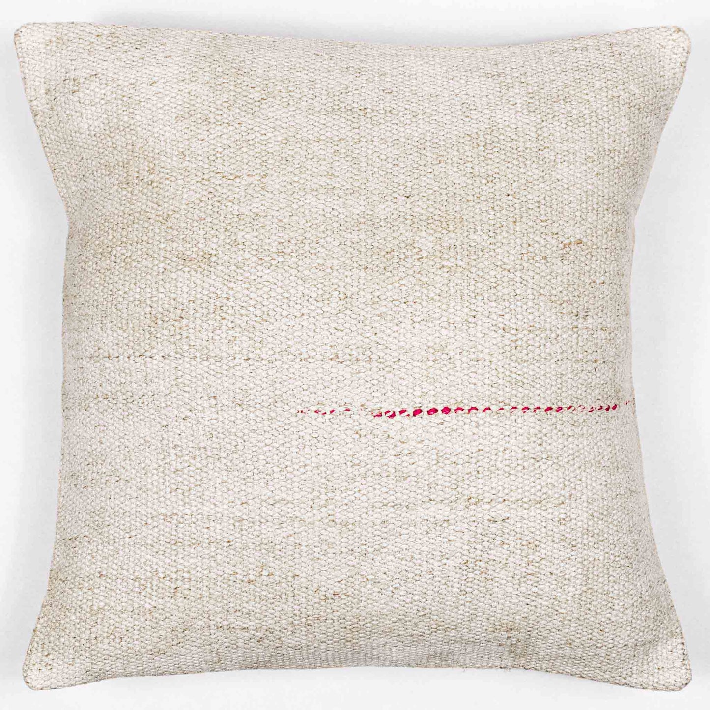 Handwoven Turkish kilim hemp pillow cover in sand and cream with single pink stitch.