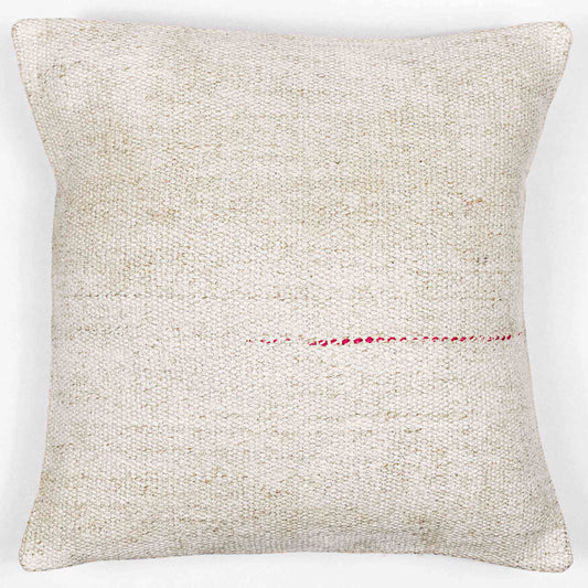 Handwoven Turkish kilim hemp pillow cover in sand and cream with single pink stitch.