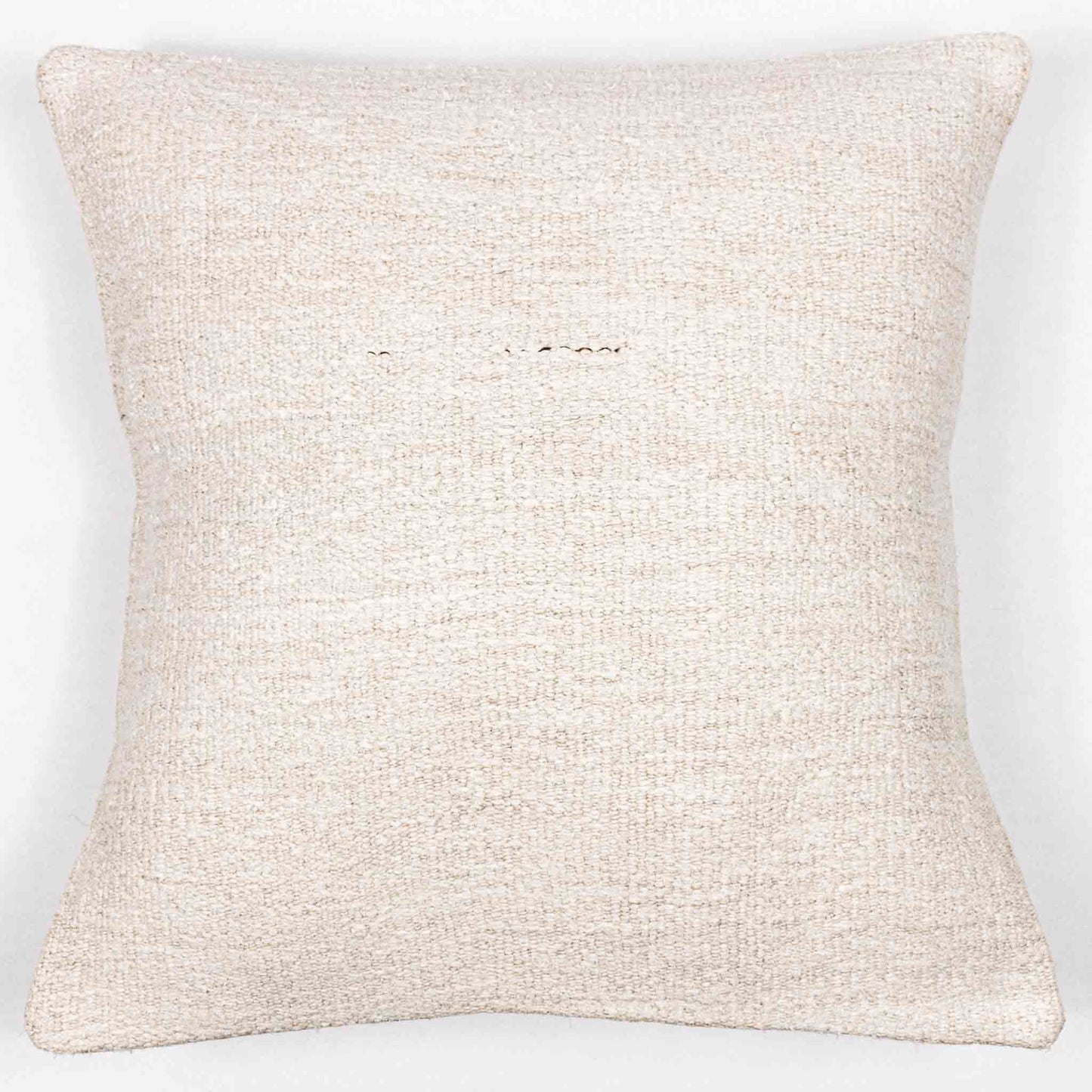 Handwoven Turkish kilim hemp pillow cover in sand with single brown stitch.